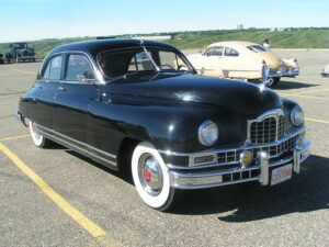 1948 Packard - Cadillac in background