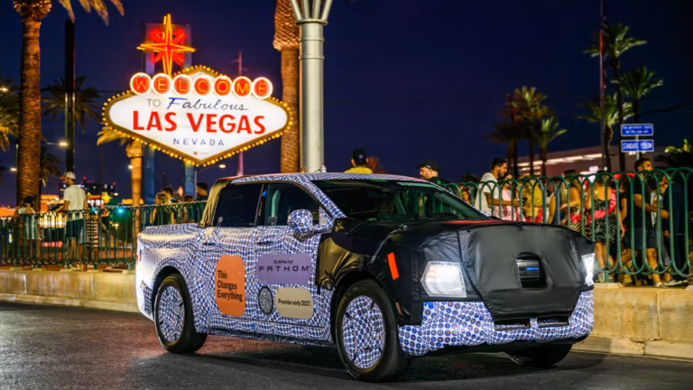 Ford Fathom in pre-introduction black and white camouflage posing by the Las Vegas sign