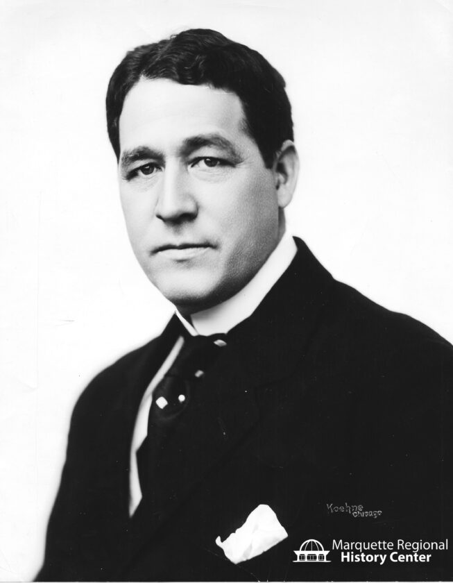 Picture of Louis G. Kaufman in high collar shirt, tie, and suit